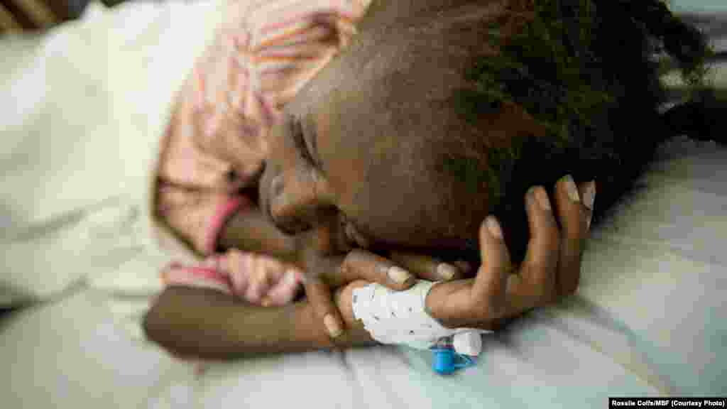 Elise, 12, was infected with HIV during her mother's pregnancy. She received antiretroviral treatment erratically in the early years because of her mother's lack of knowledge on how best to care for an HIV-positive child. As a result she developed a resistance to the first set of antiretroviral drugs. Elise lost her battle with HIV and died a few days after these pictures were taken, Kinshasa. Her mother Agathe wanted MSF to publish these pictures. "It cannot help Elise, but it may help others in the country," she said. (MSF/Rosalie Colfs)