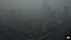 Skyscrapers are obscure by heavy haze in Beijing, China, January 13, 2013. 