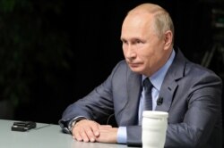 FILE - Russian President Vladimir Putin gives an interview in Sochi, Russia, in this undated photo released Oct.13, 2019. (Sputnik/Mikhail Klimentyev/Kremlin via Reuters)