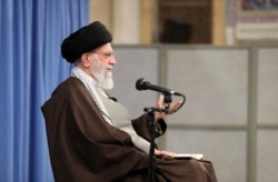 In this picture released by the official website of the office of the Iranian supreme leader, Supreme Leader Ayatollah Ali Khamenei talks to clerics in his Islamic thoughts class in Tehran, Nov. 17, 2019.