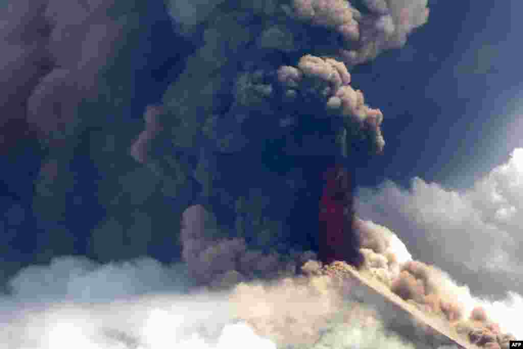 This handout from Niugini Helicopters shows Papua New Guinea's Mount Ulawun volcano spewing lava.