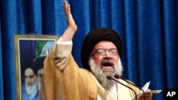 FILE - Iranian senior cleric Ahmad Khatami delivers his sermon during Friday prayers, in Tehran, Iran, Jan. 5, 2018.