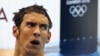 Michael Phelps of the U.S. reacts after finishing in fourth place in the men's 400m individual medley during the London 2012 Olympic Games at the Aquatics Centre July 28, 2012. REUTERS/Michael Dalder (BRITAIN - Tags: SPORT OLYMPICS SPORT SWIMMING) 