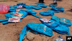 Children's backpacks lie at the site a day after an airstrike in Saada, Yemen, Aug. 10, 2018. 