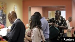 People wait in line to meet with job counselor during a job fair at Workforce1 in New York, September 6, 2012. 