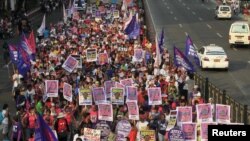 The raid in which Zulkifli bin Hir was killed also left 44 police commandos dead, and a Philippine senate panel held President Benigno Aquino responsible for the bungled operation. Above, protesters march toward the presidential palace in Manila, March 20, 2015.
