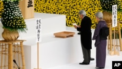 Japan's Emperor Akihito delivers his remarks with Empress Michiko during a memorial service at Nippon Budokan martial arts hall in Tokyo, Aug. 15, 2017. Japan marked the 72nd anniversary of its World War II surrender. 