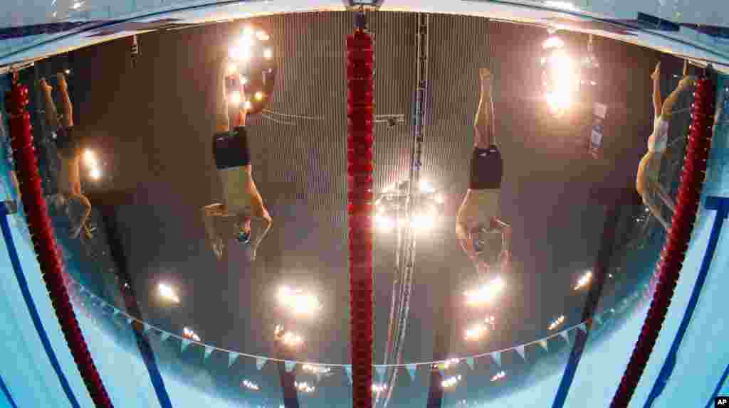 Michael Phelps, left, and Ryan Lochte, both from the U.S., start in the men's 200-meter individual medley swimming final.