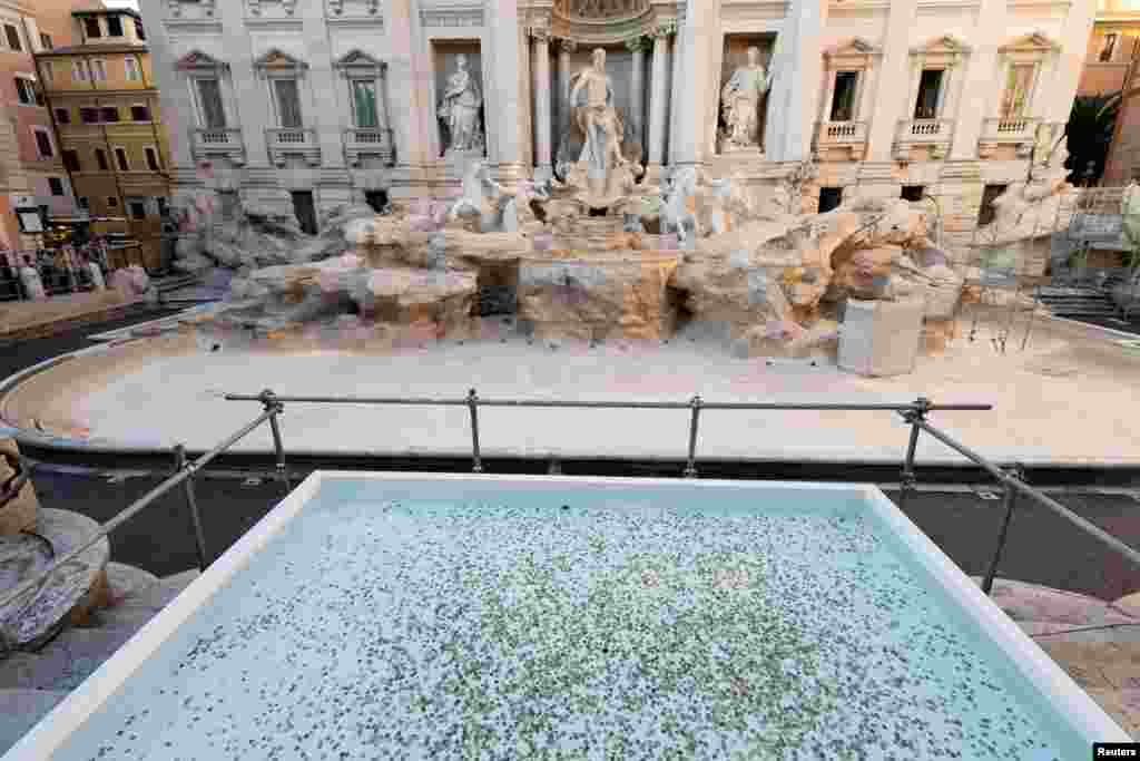 A pool was created to collect tourists' coins and wishes as the Trevi fountain undergoes maintenance works in Rome, Oct. 31, 2024