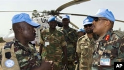 UNAMID Force Commander, Lieutenant General Patrick Nyamvumba (R), visits the Nertiti UNAMID Camp Site in El-Fasher, west Darfur, to get information about an ambush where three Rwandan peacekeepers were killed, 22 Jun 2010