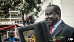 FILE - Kenya's Cabinet Secretary for National Treasury Henry Rotich leaves with the budget briefcase for Parliament to read the budget speech for 2018-2019 in Nairobi, Kenya, on June 14, 2018.
