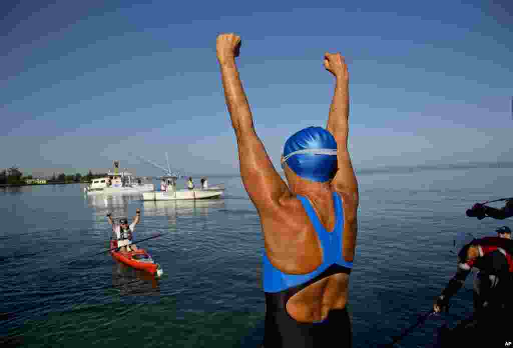 Swimmer Diana Nyad greets her support team before her swim to Florida from Havana, Cuba, Aug. 31, 2013.
