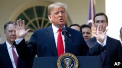 President Donald Trump speaks as he announces a revamped North American free trade deal, in the Rose Garden of the White House in Washington, Oct. 1, 2018. 