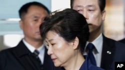 FILE - Ousted South Korean President Park Geun-hye arrives at the Seoul Central District Court for a hearing on a prosecutors' request for her arrest for corruption, in Seoul, South Korea, March 30, 2017.