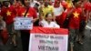 FILE - Anti-corruption activist Le Hien Duc (C) is assisted by anti-China protesters as they march during a protest along a street in Hanoi.