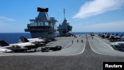 F-35B Lightning II aircrafts are seen on the deck of the HMS Queen Elizabeth aircraft carrier offshore Portugal, May 27, 2021.