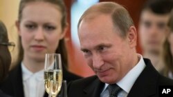 FILE - Russian President Vladimir Putin in the Grand Kremlin Palace in Moscow, Nov. 19, 2014. 