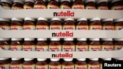 FILE - Jars of Nutella chocolate hazelnut paste are displayed in France, April 6, 2016.
