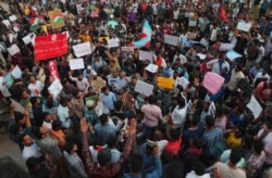 Indian students take part in a rally against a new citizenship law, at Osmania University campus, in Hyderabad, India, Dec.17, 2019.