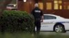 A police chaplain approaches the scene of shooting that killed 12 people in Virginia Beach, Va, May 31, 2019.