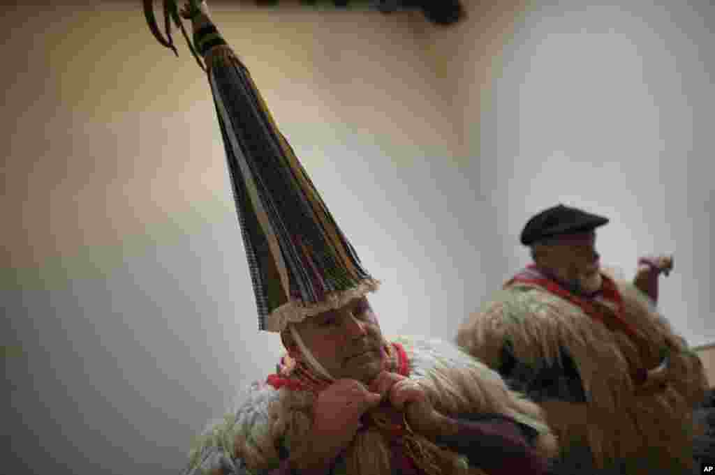 Joaldunak, also caled ''Zanpantzar,'' prepare to take part in the Carnival of the Pyrenees village of Ituren, northern Spain. In one of the most ancient carnivals in Europe, dating from before the Roman empire, groups of Joaldunak (cowbells) involving the residents of two towns, Ituren and Zubieta, parade the streets in costume.