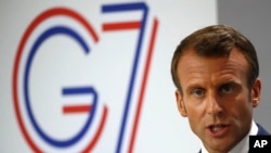French President Emmanuel Macron speaks during his final press conference at the G-7 summit, Aug. 26, 2019, in Biarritz, southwestern France.