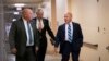 From left, Rep. Glenn Thompson, R-Pa., Rep. Steve Womack, R-Ark., and Rep. Tom MacArthur, R-N.J., walk to a closed-door GOP meeting in the basement of the Capitol as the Republican leadership tries to reach a policy agreement between conservatives and moderates on immigration, in Washington, June 7, 2018. 