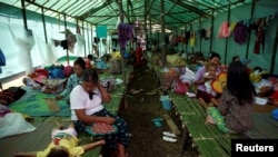 People displaced in the conflict between Kachin Independence Army (KIA) and Myanmar military for the control of an amber mine are seen at a Christian church in Tanai township, Kachin state, Myanmar June 14, 2017.