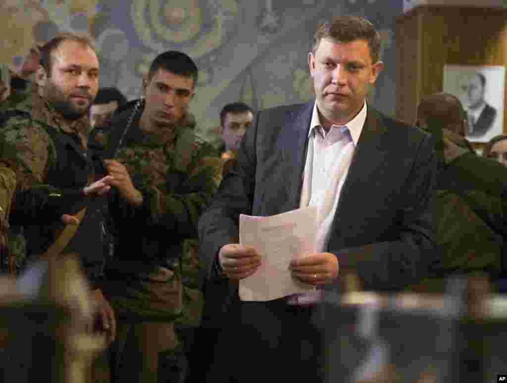 Pro-Russian rebel leader Alexander Zakharchenko prepares to cast his ballot in elections held by pro-Russian separatists, Donetsk, Nov. 2, 2014.