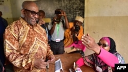 FILE - Comoros President Azali Assoumani arrives at a polling station to cast his ballot during a constitutional referendum outside Moroni, the capital of the Comoros archipelago off Africa's eastern coast, July 30, 2018.