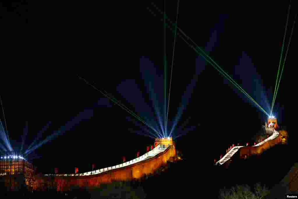 Lights and lasers illuminate the Great Wall of China to celebrate the new year before the countdown event at the Badaling section of the Great Wall, Beijing, China, Dec. 31, 2013. 
