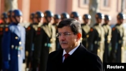 Turkey's Prime Minister Ahmet Davutoglu arrives at welcoming ceremony, Ankara, Dec. 25, 2014.