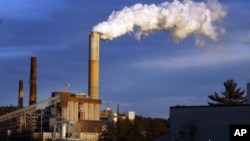 FILE - A plume of steam billows from the coal-fired Merrimack Station in Bow, N.H., Jan. 20, 2015.