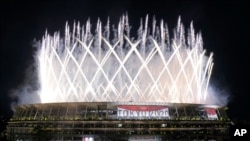 Fireworks illuminate the National Stadium during the opening ceremony of the 2020 Summer Olympics in Tokyo, Japan, July 23, 2021.