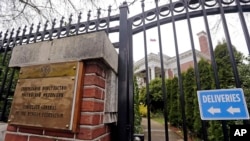 FILE - A metal fence surrounds the residence of Russia's consul general in Seattle, March 26, 2018. The United States and more than a dozen European nations kicked out Russian diplomats on Monday, and the Trump administration ordered Russia's consulate in Seattle to close. 