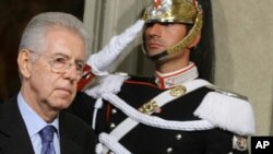 Italy's new premier-designate economist Mario Monti walks past a Cuirassier presidential guard at the Quirinale Presidential Palace in Rome after talks with Italian President Giorgio Napolitano, Sunday, Nov. 13, 2011.
