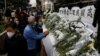 People queue up to pay tribute to former Chinese President Jiang Zemin, after he died aged 96, outside China's Liaison Office, in Hong Kong, Dec. 1, 2022.