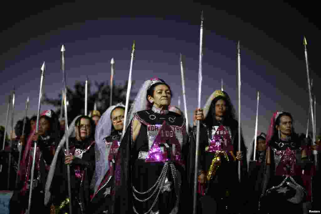 Worshipers attend the Day of the Spiritual Indoctrinator annual celebrations at the Vale do Amanhecer (Valley of the Dawn) community in the Planaltina neighborhood of Brasilia, Brazil. The Vale do Amanhecer is a Christian Spiritualistic doctrine founded by the spiritualist visionary known as Tia Neiva (Aunt Neiva) in 1958 in Brazil's Federal District.