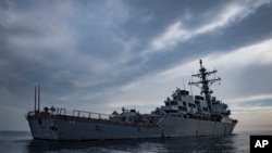 FILE - This image provided by the U.S. Navy shows the USS Carney in the Mediterranean Sea on Oct. 23, 2018.