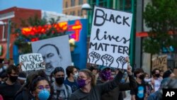 Demonstrators protest the death of George Floyd in downtown Albuquerque, New Mexico, May 31, 2020.