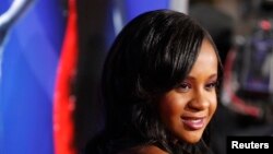 FILE - Bobbi Kristina Brown, daughter of the late singer Whitney Houston and singer Bobby Brown, poses at the premiere of "Sparkle" in Hollywood, California, August 16, 2012.