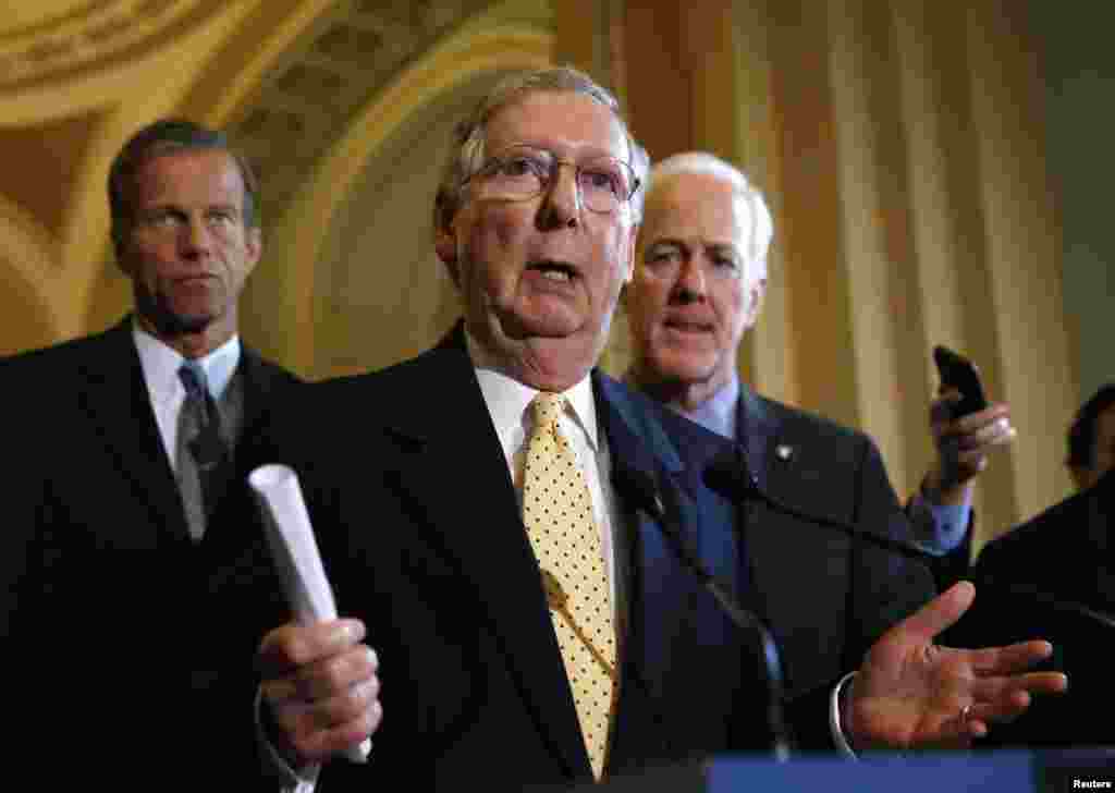 Senate Republican Minority Leader Mitch McConnell speaks to reporters after the Republican party policy luncheon in the Capitol, in Washington, Sept. 16, 2014.