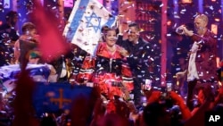 In this May 12, 2018 file photo, Netta Barzilai from Israel celebrates after winning the Eurovision 2018 song contest in Lisbon, Portugal. (AP Photo/Armando Franca, File)