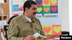 Venezuela's President Nicolas Maduro speaks during his weekly Sunday radio and TV broadcast in Caracas, Nov. 12, 2017. 