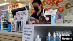 A pharmacy displays a sign to inform customers that Rapid Antigen Test kits are sold out in wake of the coronavirus disease in Sydney, Australia, Jan. 5, 2021. 