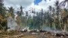 Les restes d'un avion C-130 de l'armée philippine qui s'est écrasé dans la ville de Patikul, dans la province de Sulu, dans le sud des Philippines, le dimanche 4 juillet 2021.