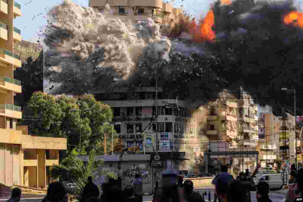 Fire and smoke erupt from a building just after an Israeli airstrike in Beirut's southern Shayah neighborhood, amid the ongoing war between Israel and Hezbollah.