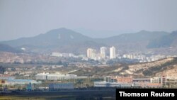 Kaesong city is seen behind the inter-Korean Kaesong Industrial Complex, across the DMZ separating North Korea from South Korea in this picture taken from Dora observatory in Paju, July 26, 2020.