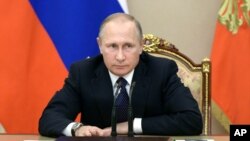 Russian President Vladimir Putin heads a meeting on the budget in Moscow's Kremlin, Russia, Sept. 26, 2016.