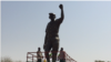 La statue du Président Thomas Sankara au conseil de l'Entente, Ougadougou, le 3 mars 2019. (VOA/ Lamine Traoré)